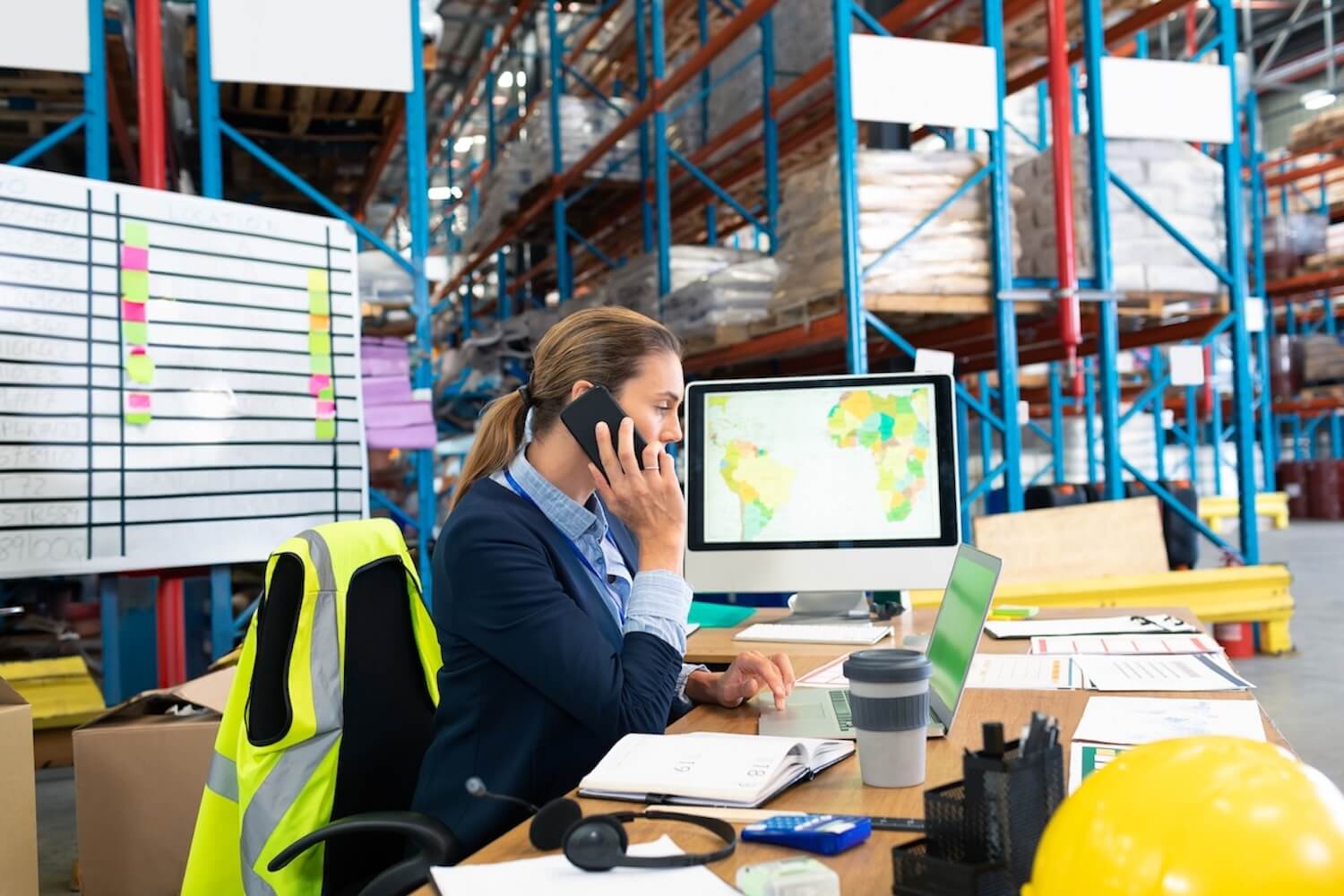 businesswoman-in-warehouse-talking-on-phone-and-wo-2025-04-03-00-33-41-utc.jpg