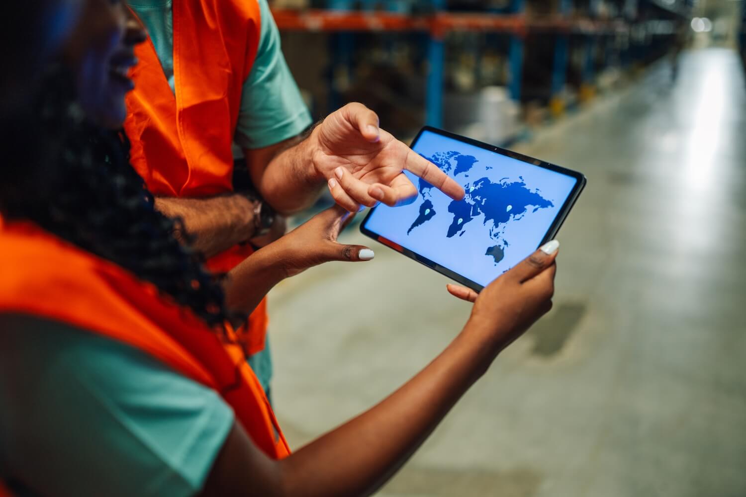 warehouse-workers-using-digital-tablet-showing-wor-2025-04-03-21-00-57-utc.jpg